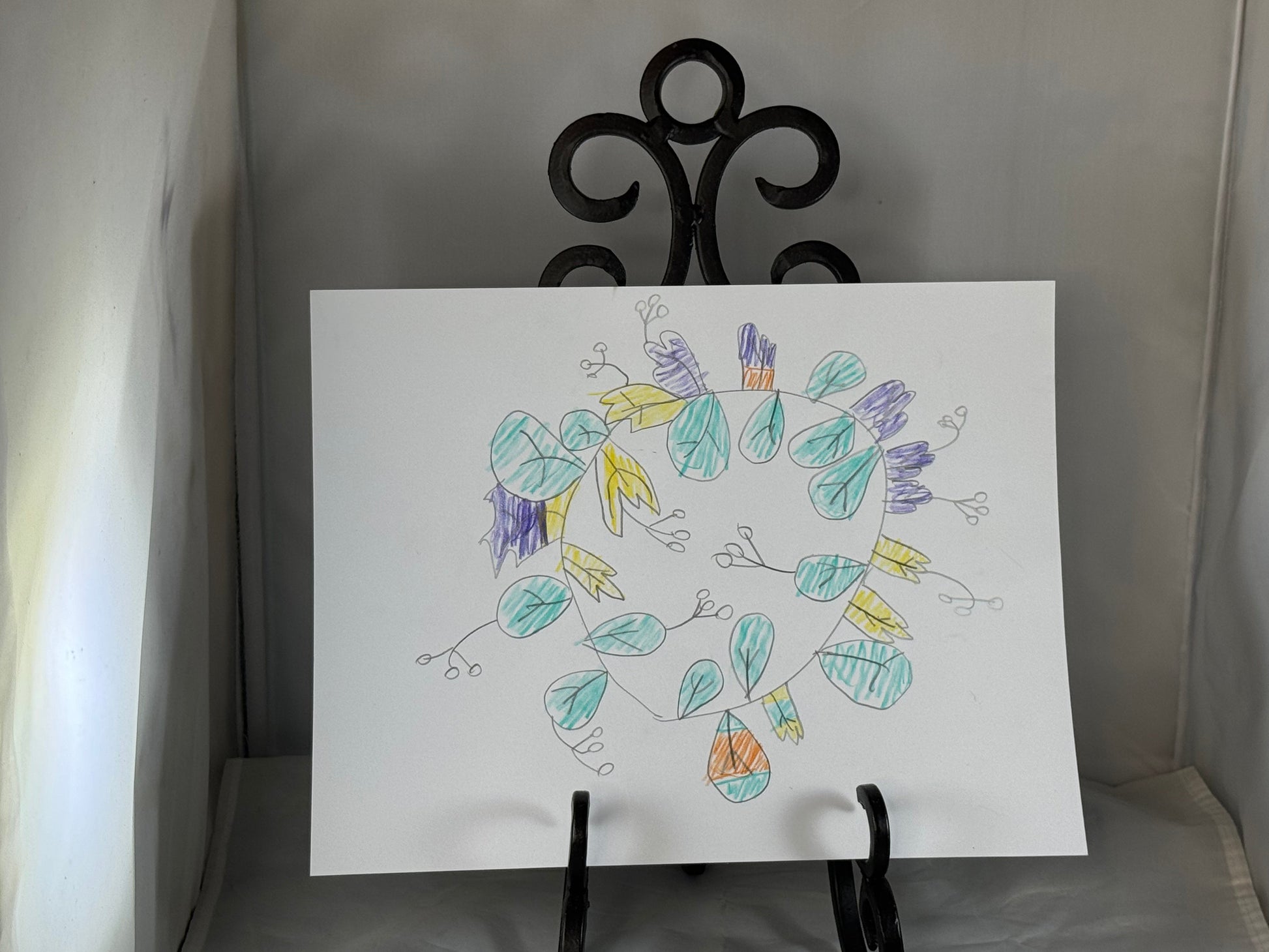 Kid art for sale to help those in need. Pictured "Leaf Wreath" by Zane M. (Cardstock, 8.5" x 11")